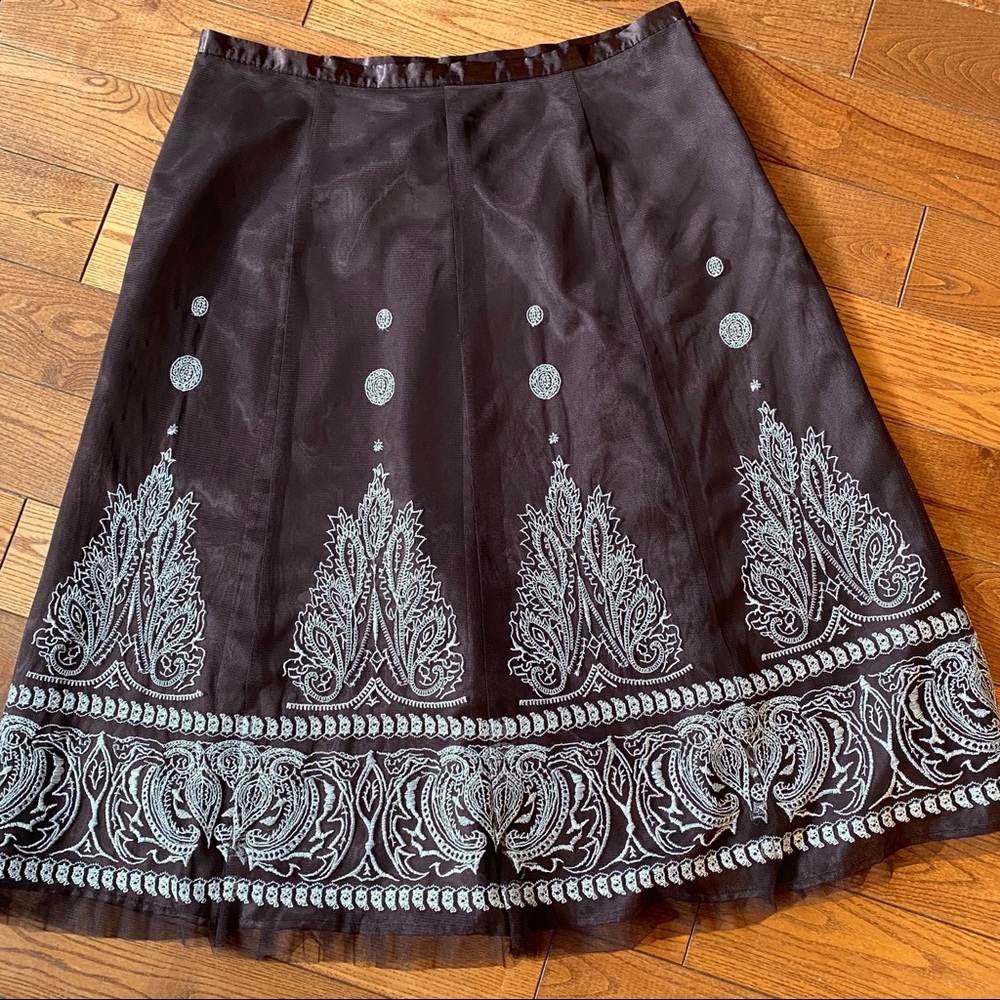 Nygard Collection embroidered net overlay skirt.